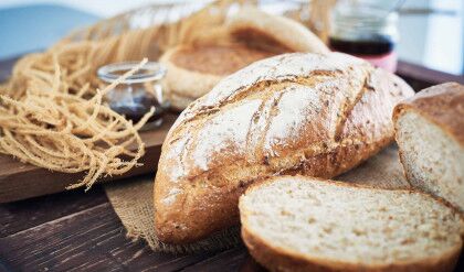 Fresh Bread On Wooden Table With Butter And Mix Fruit Jam.