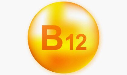 Vitamin B12 with realistic drop on gray background. Particles of vitamins in the middle. Vector illustration