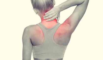 fitness, healthcare and medicine concept - sporty woman touching her neck