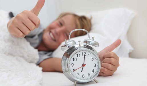 Happy,Boy,Awake,With,His,Alarm,Clock,And,Thumbs,Up